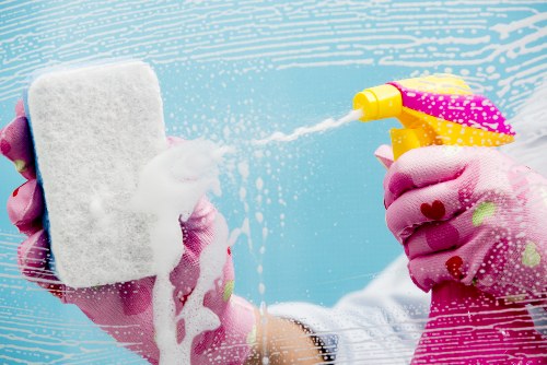 Technician applying carpet cleaning solution with care and control