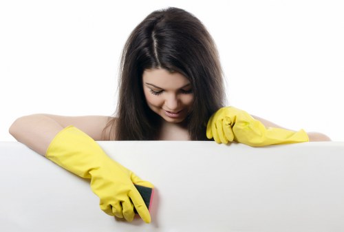 Technician cleaning curtains in a Loxford property