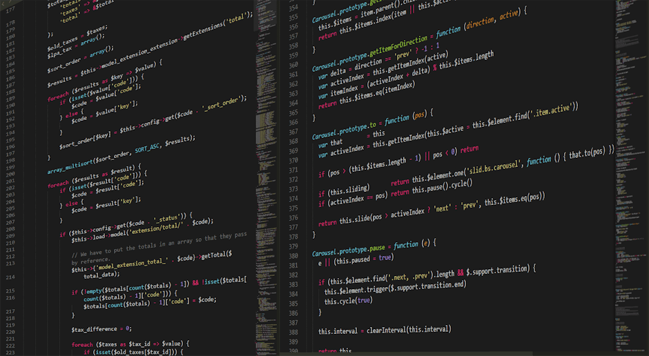 A photograph of a computer screen displaying HTML code, including tags such as <DOCTYPE html>, <html>, <head>, and <body>. The code is color-coded with blue for tags, purple for attributes, and orange